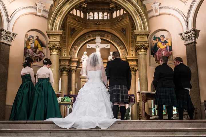 Couple at the cathedral altar